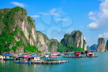 Floating village near rock islands in Halong Bay, Vietnam, Southeast Asia