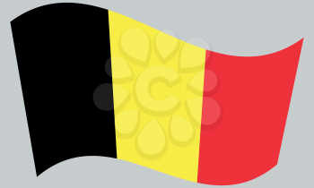 Flag of Belgium waving on gray background
