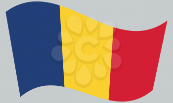 Flag of Romania waving on gray background