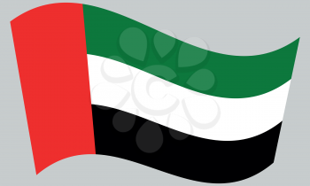 Flag of the United Arab Emirates waving on gray background