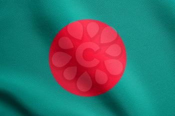 Flag of Bangladesh waving in the wind with detailed fabric texture. Bangladeshi national flag.