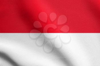 Flag of Indonesia, Monaco, Hesse waving in the wind with detailed fabric texture. Indonesian national flag.