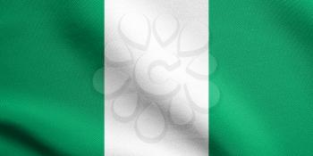 Flag of Nigeria waving in the wind with detailed fabric texture. Nigerian national flag.