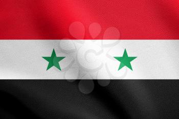Flag of Syria waving in the wind with detailed fabric texture. Syrian national flag.
