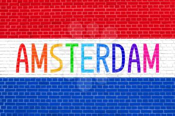 Flag of the Netherlands on brick wall texture background. Multicolored word Amsterdam.