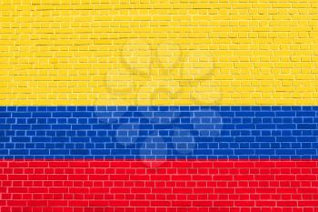 Flag of Colombia on brick wall texture background. Colombian national flag.