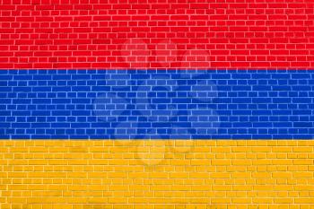 Flag of Armenia on brick wall texture background. Armenian national flag.