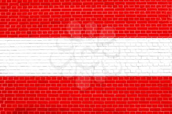 Flag of Austria on brick wall texture background. Austrian national flag.