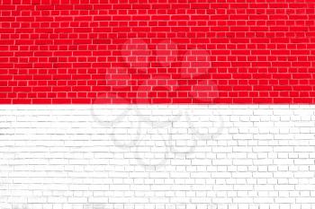 Flag of Indonesia, Monaco, Hesse on brick wall texture background. Indonesian national flag.