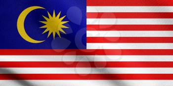 Flag of Malaysia waving in the wind with detailed fabric texture. Malaysian national flag.