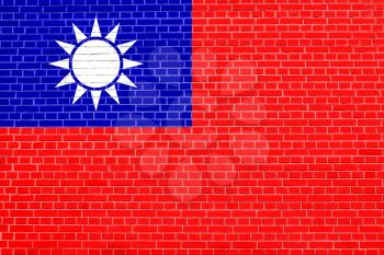 Flag of the Republic of China, ROC, Taiwan, on brick wall texture background. The national flag of Taiwan.
