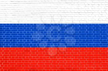 Flag of Russia on brick wall texture background. Russian national flag.