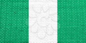 Flag of Nigeria on brick wall texture background. Nigerian national flag.