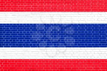 Flag of Thailand on brick wall texture background. Thai national flag.