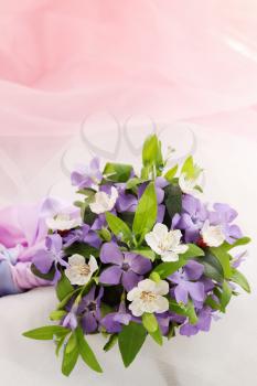 small wedding bouquet of violets and apricot
