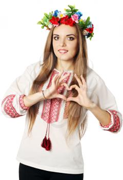 Beautiful Ukrainian woman shows gesture in the form of heart