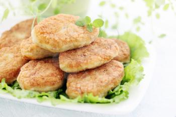Large fried cutlets with thyme and lettuce