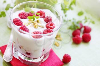 Delicious dessert with fresh raspberries and pistachios