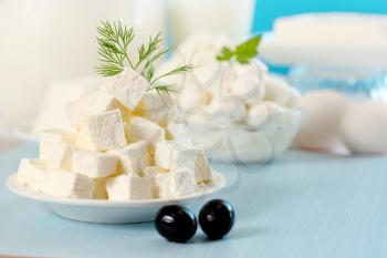 Feta cheese cut into slices on a plate