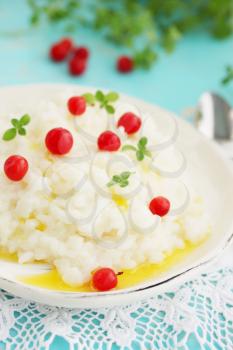 Milk rice porridge with butter and cherry