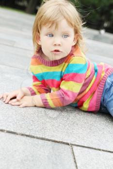 portrait of a little girl in a striped pullover