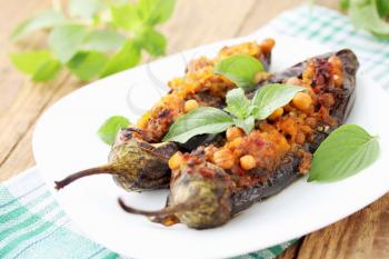 Baked eggplant stuffed with minced meat, chick-pea and vegetables