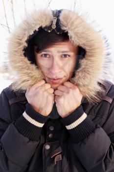 Asian man in a winter jacket with a hood