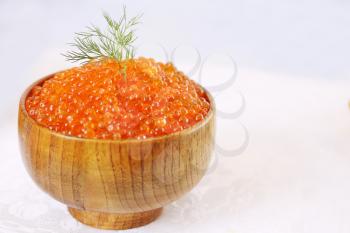 Red Red caviar in a large wooden bowl