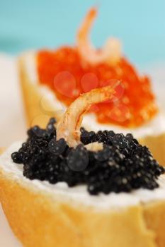 sandwich with red, black caviar and shrimp