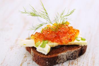 sandwich with butter, caviar, dill and onion