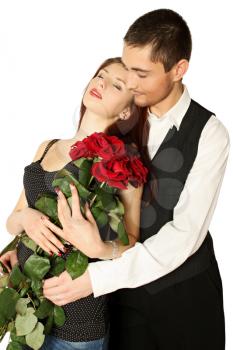 Young couple with bouquet a rose on a white background