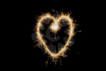 Royalty Free Photo of a Heart Drawn With a Sparkler