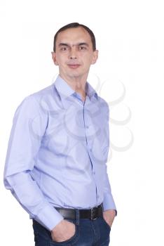 Young man with hands in pocket, isolated on white background