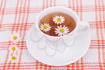 Cup of tea with chamomile.