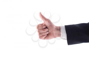Hand man in a suit giving a thumbs up on a white background.