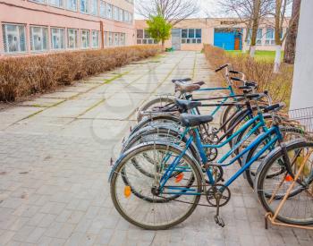 Five Old Bikes Bicycle Leaning On The Street. Belarus, Dobrush