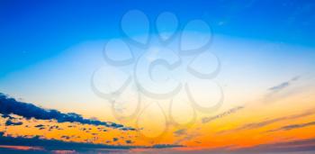 Bright blue, orange and yellow colors sunset sky. Colorful sunrise background