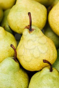 Green And Yellow Ripe Pears At A Farmers Market. Fruits Background