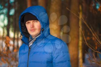 Portrait Of Young Cheerful Man Outdoor In Winter Forest