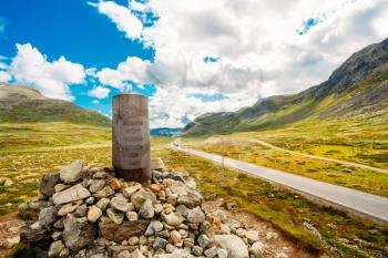 Navigation Mark Pointer Near Highway On Norwegian Mountain