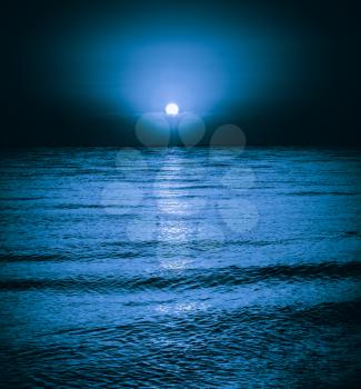 Moon Reflecting In A Lake Sea Ocean Waves. Moonlight Night Background