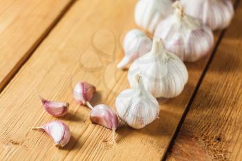Healthy Organic Garlic Vegetables Whole And Cloves On The Wooden Background