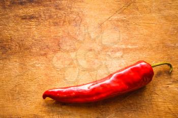 Red Hot Chili Peppers On Old Wooden Table Surface Texture Background