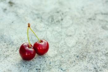 Cherries Against Gray Background