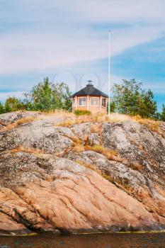 Yellow Finnish Lookout Wooden House On Rock In Island In Summer