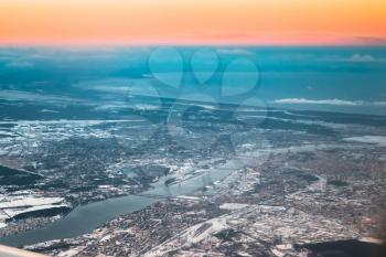 View From Airplane Window on Riga, Latvia. Sunset Sunrise Over Gulf Of Riga, Bay Of Riga, Or Gulf Of Livonia. Capital City
