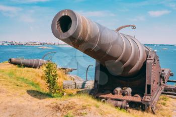 Historic cannon at Suomenlinna, Sveaborg maritime fortress In Helsinki, Finland. Sunny Day With Blue Sky. UNESCO World Heritage Site