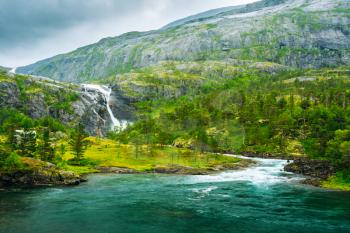 Giant Waterfall in the Valley of waterfalls in Norway. Husedalen Waterfalls were a series of four giant waterfalls in the South Fjord.