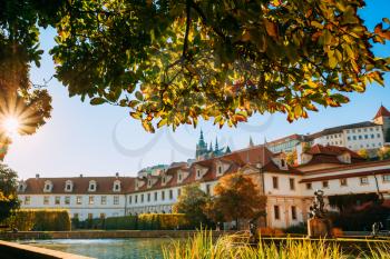 The facade of the palace and portion of the Wallenstein Garden with Prague Castle in the background. Czech Republic