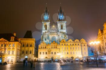 Prague, Czech Republic. Church Of Our Lady Before Tyn In Old Town Square At Night Street Illumination Lights.